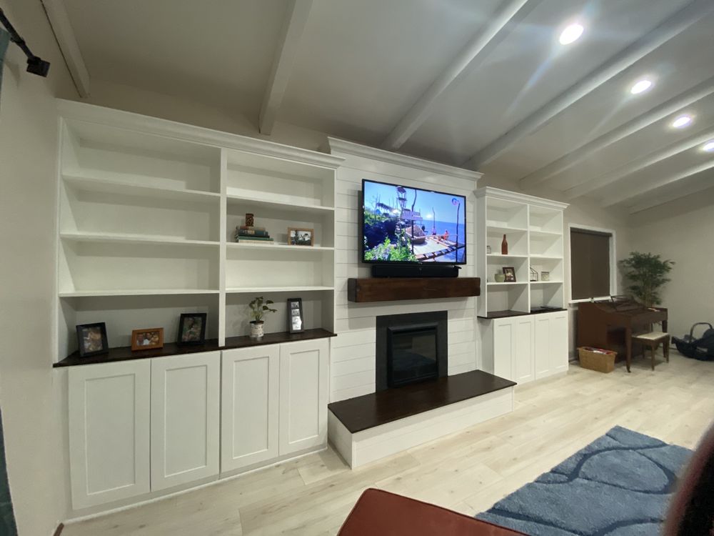 Large TV console with built-in fireplace, freshly painted white