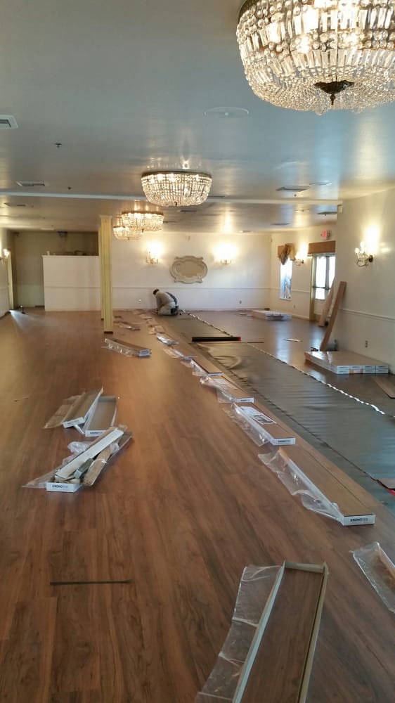 Handyman installing new vinyl plank floor