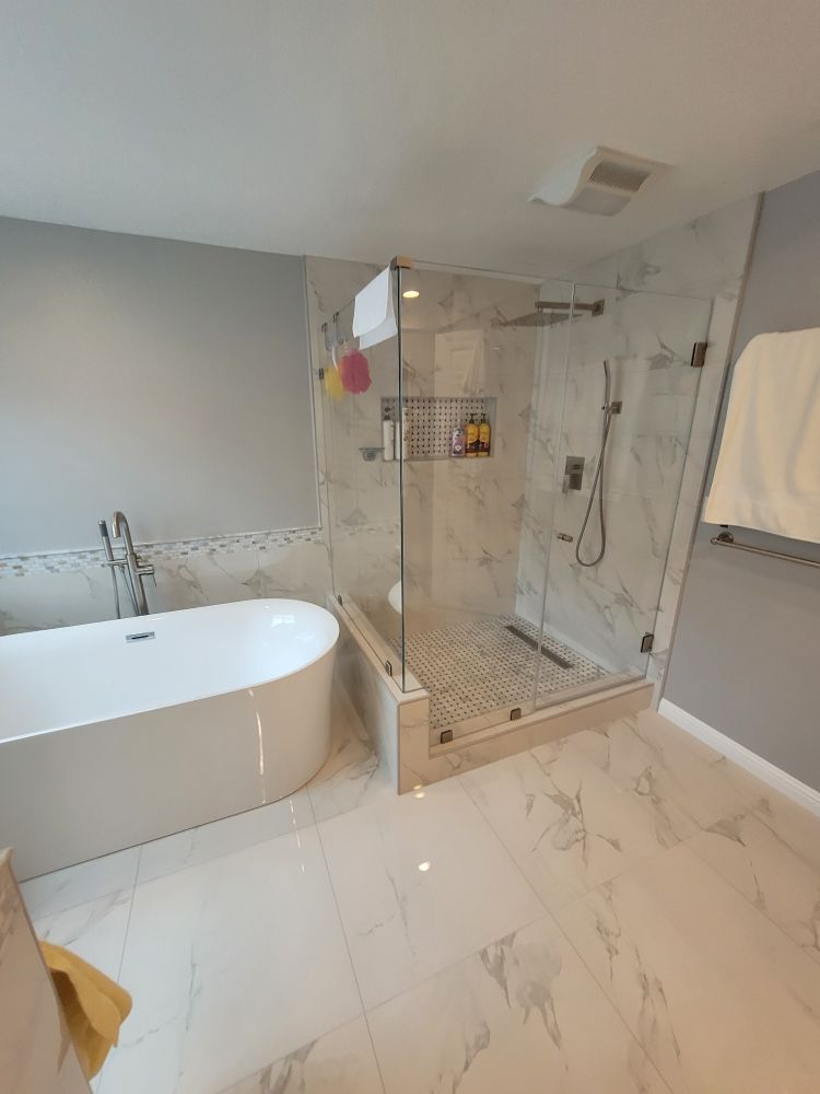 Newly remodeled bathroom with a large glass shower