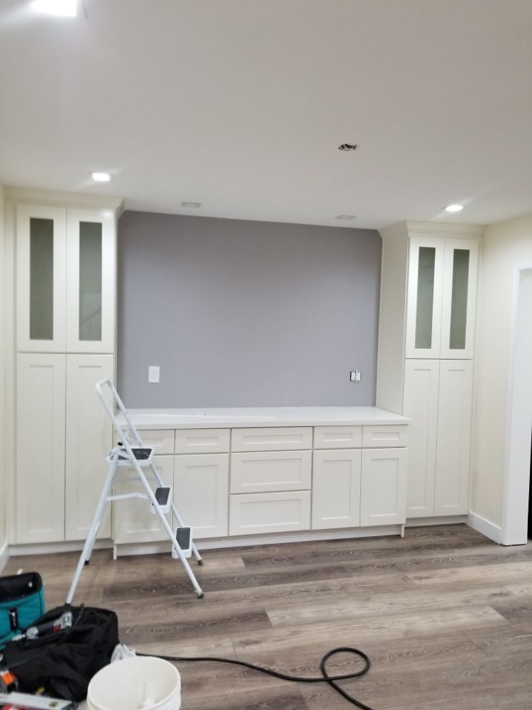 In-progress shot of interior painter from Kevin's Handyman painting living room in San Jose home