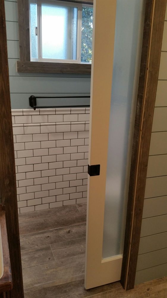 Frosted glass pocket door in bathroom
