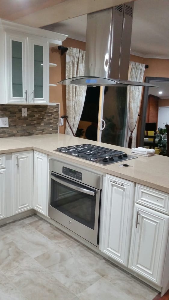 New gas stove and vent hood installed as part of kitchen remodel in San Jose home