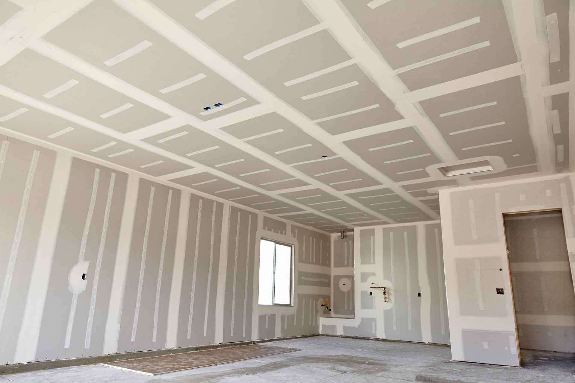 Newly hung drywall, ready to be painted